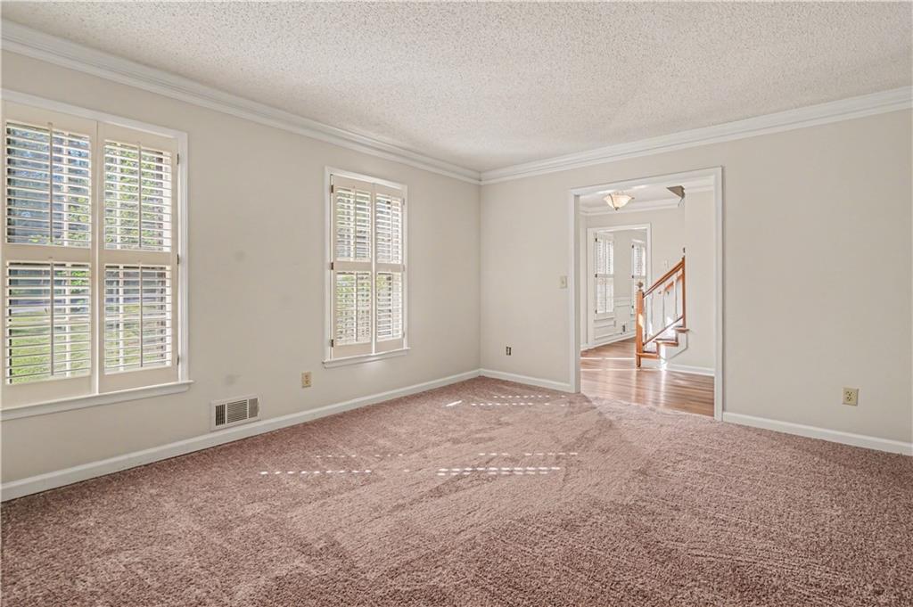 1527 Ridgewood Drive Southwest Lilburn, GA 30047 - Photo 6 of 19 a view of an empty room with a window