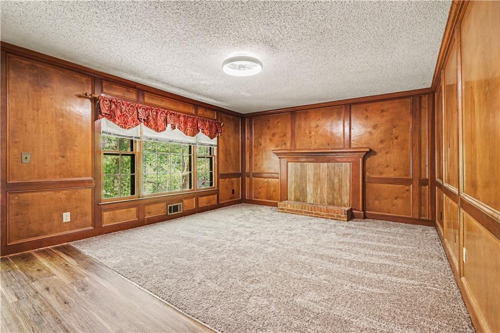 1527 Ridgewood Drive Southwest Lilburn, GA 30047 - Photo 7 of 19 a view of an empty room with a window