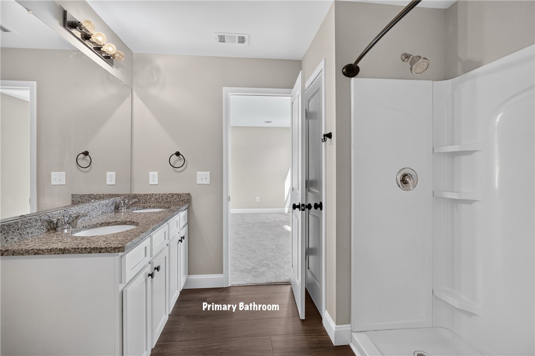 2007 Aberdeen Lane Walhalla, SC 29691 - Photo 19 of 41 Double vanity with granite counters and a clean shower stall defines this practical primary bathroom.