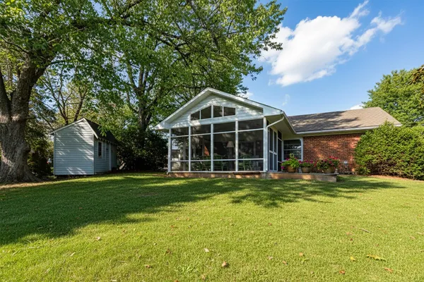 a view of a house with a yard