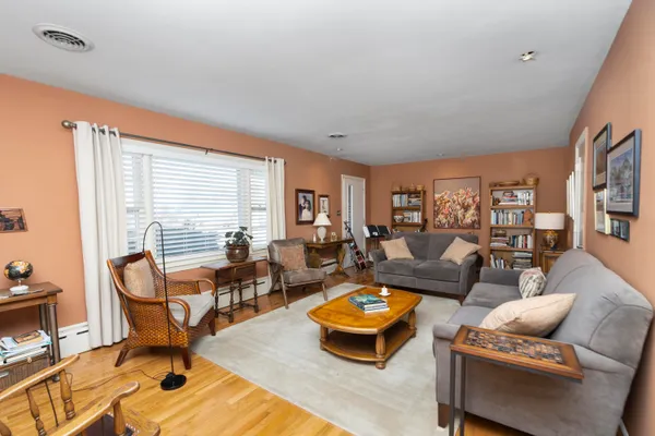 a living room with furniture and a large window