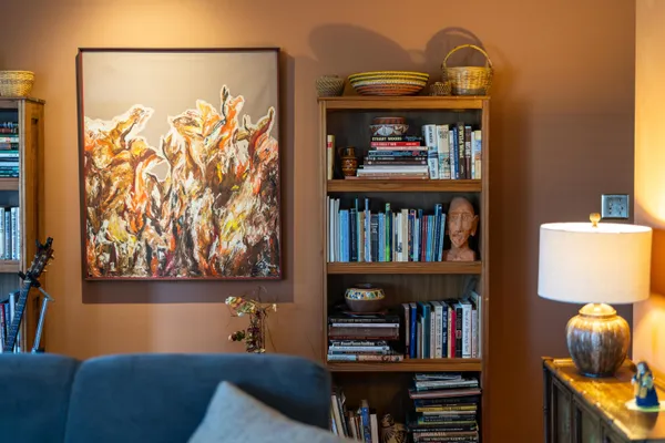 a room with furniture and book shelf