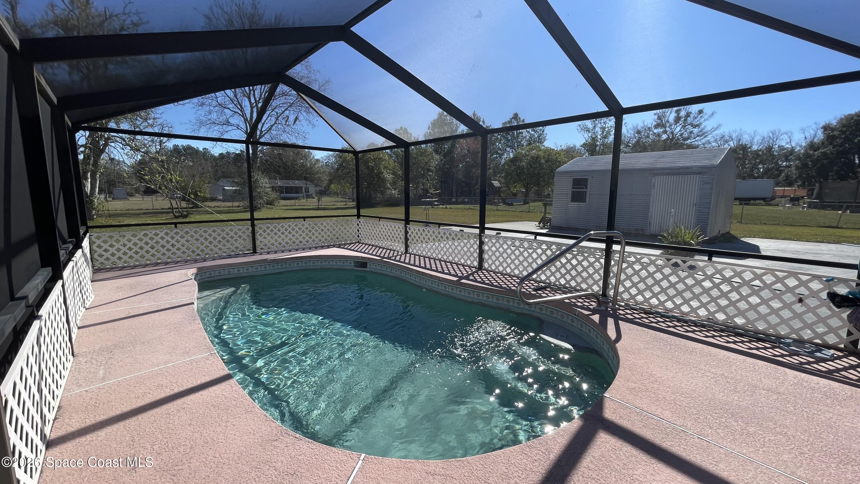 54312 Dornbush Road Callahan, FL 32011 - Photo 43 of 88 She'd & large additional patio