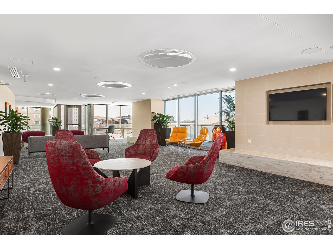 891 14th Street, Unit 1111 Denver, CO 80202 - Photo 30 of 38 a living room with furniture a flat screen tv and kitchen view