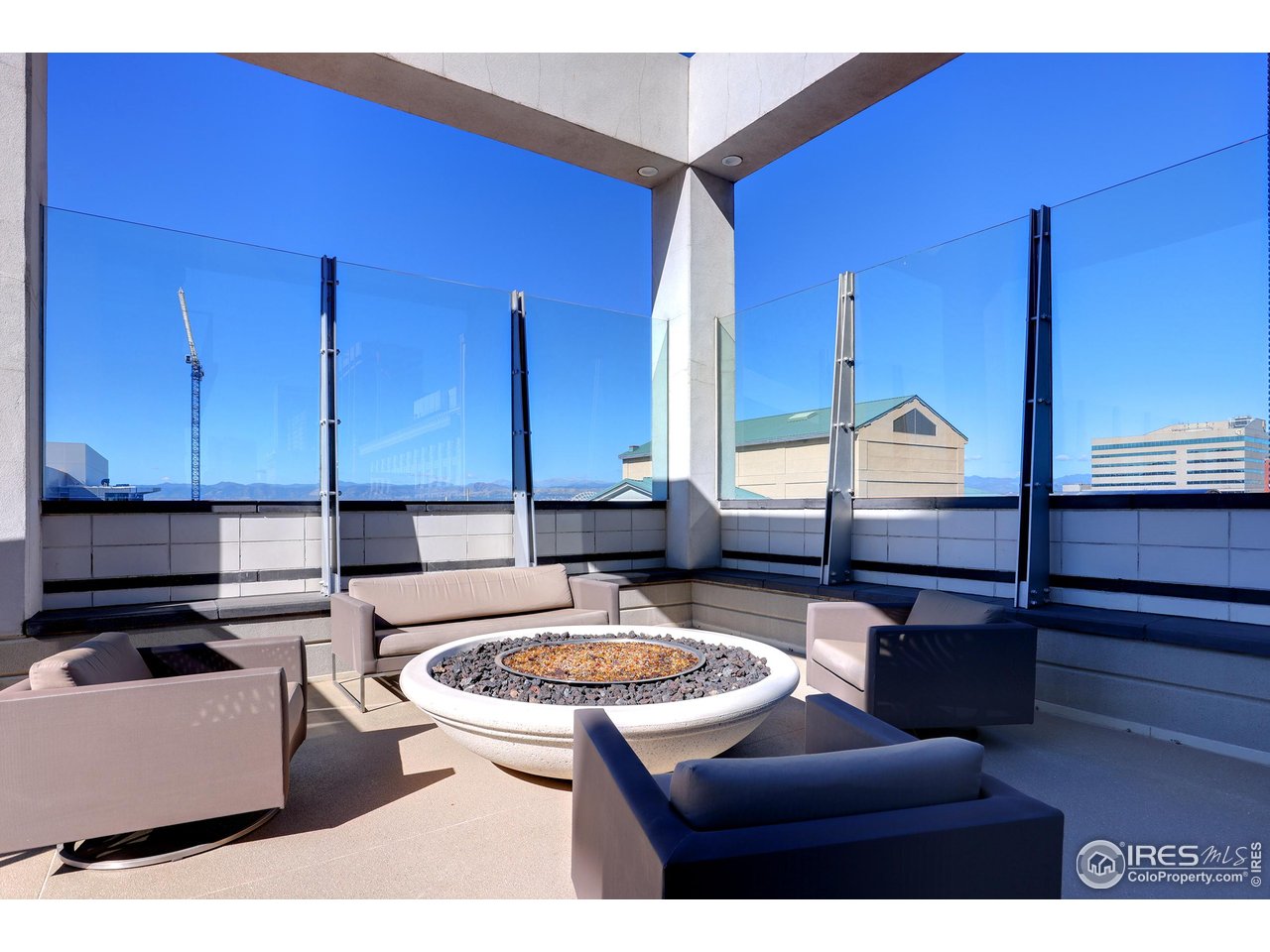 891 14th Street, Unit 1111 Denver, CO 80202 - Photo 37 of 38 a kitchen with a table chairs and a stove