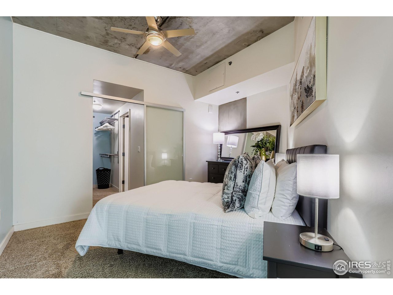 891 14th Street, Unit 1111 Denver, CO 80202 - Photo 10 of 38 a bedroom with a bed and a lamp