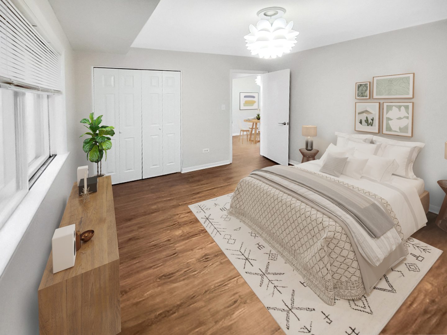 6048 West Pershing Road, Unit 8 Cicero, IL 60804 - Photo 7 of 7 a spacious bedroom with a large bed and a chandelier