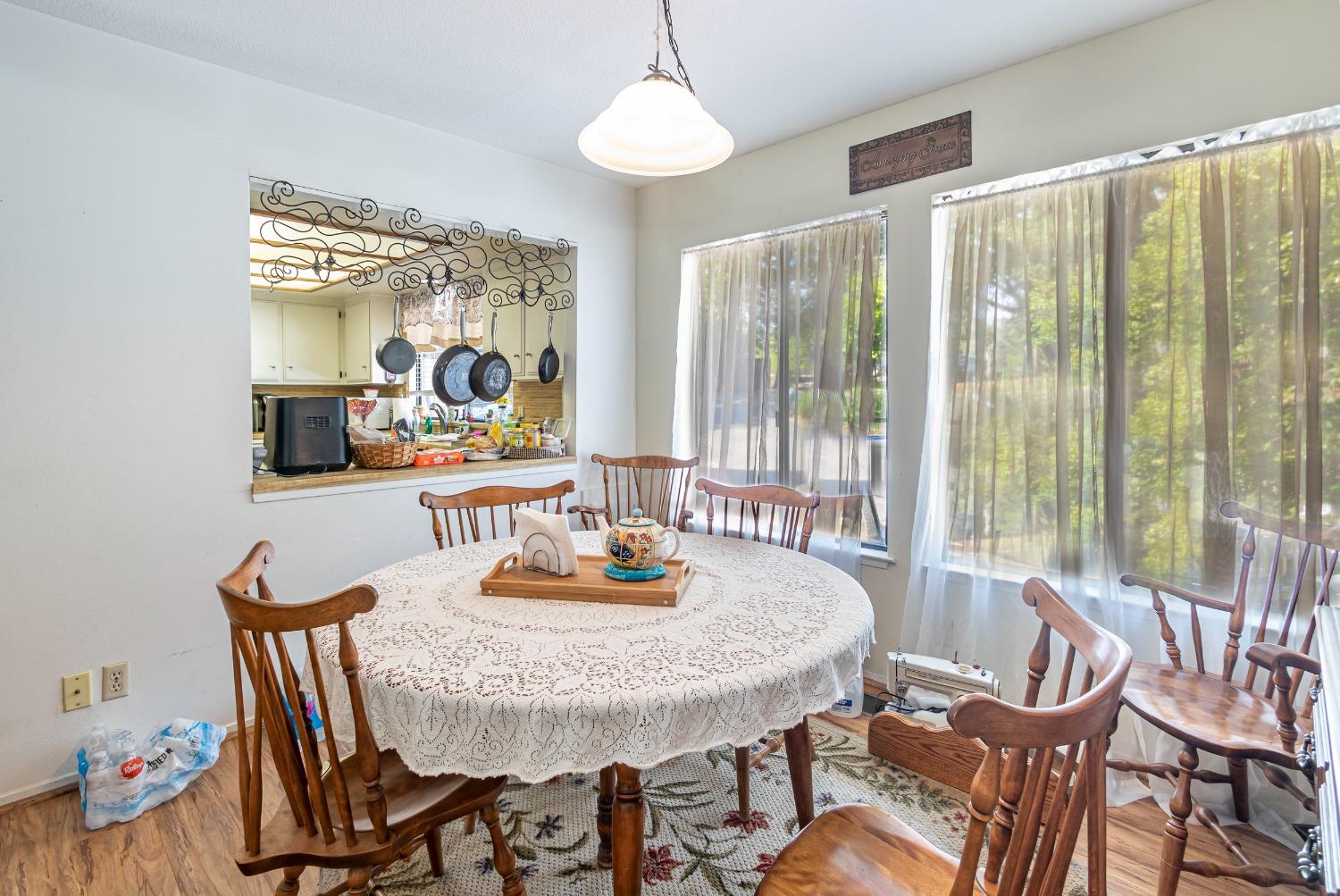 48908 Rock Point Road Oakhurst, CA 93644 - Photo 5 of 23 Dining area with opening to the kitchen.