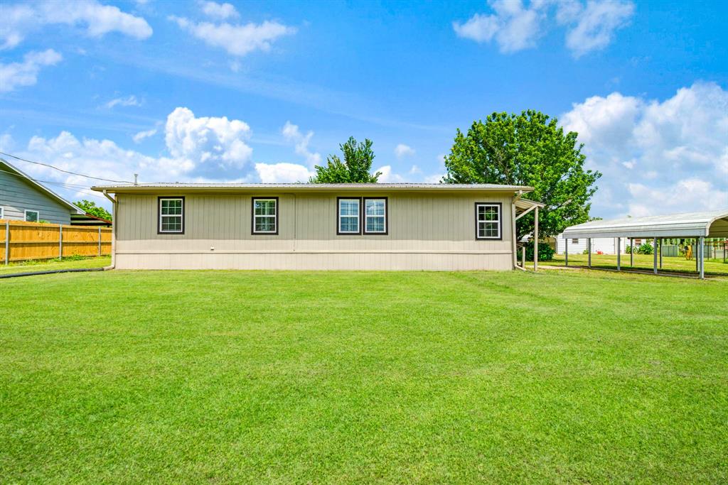 735 1st Southwest Detroit, TX 75436 - Photo 1 of 26 a front view of house with yard