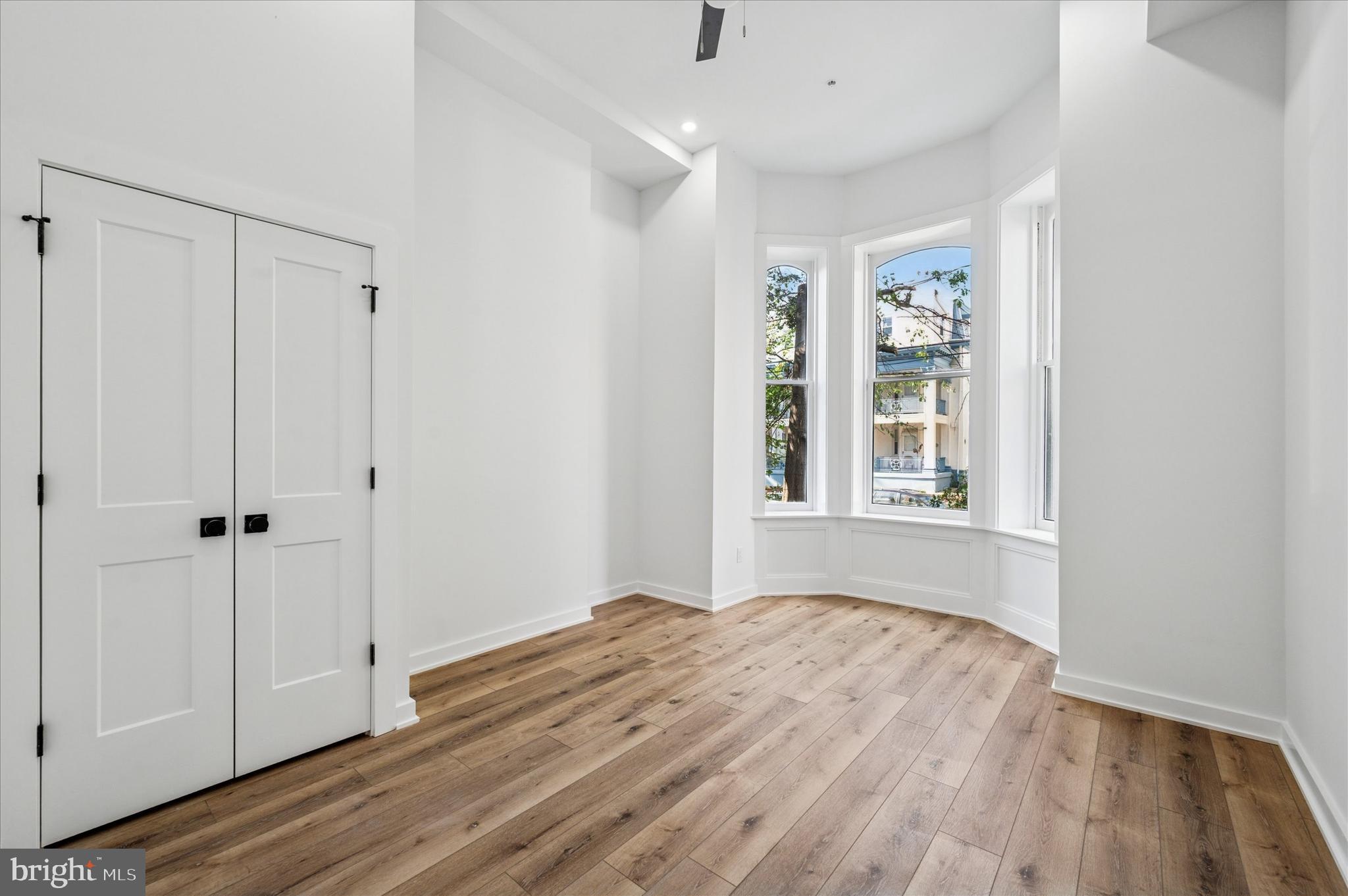 3408 Race Street, Unit 1 Philadelphia, PA 19104 - Photo 19 of 19 a view of an empty room with wooden floor and a window