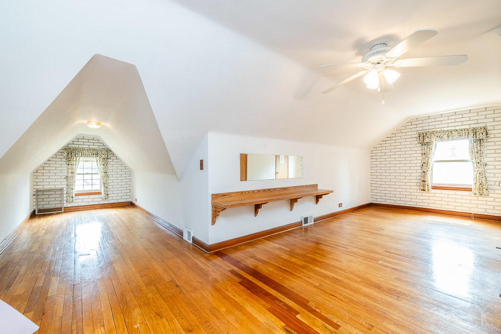 402 Longcommon Road Riverside, IL 60546 - Photo 14 of 48 a view of an empty room with wooden floor and a window