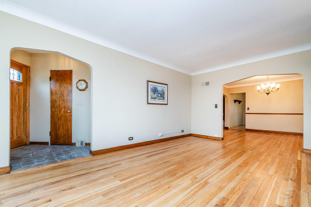 402 Longcommon Road Riverside, IL 60546 - Photo 5 of 48 a view of an empty room with wooden floor and a window