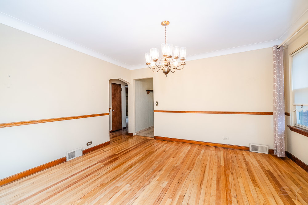 402 Longcommon Road Riverside, IL 60546 - Photo 6 of 48 a view of a room with wooden floor staircase and a kitchen