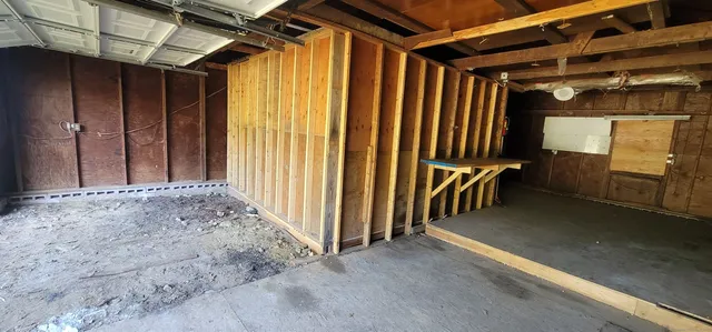 a view of hallway with wooden stairs