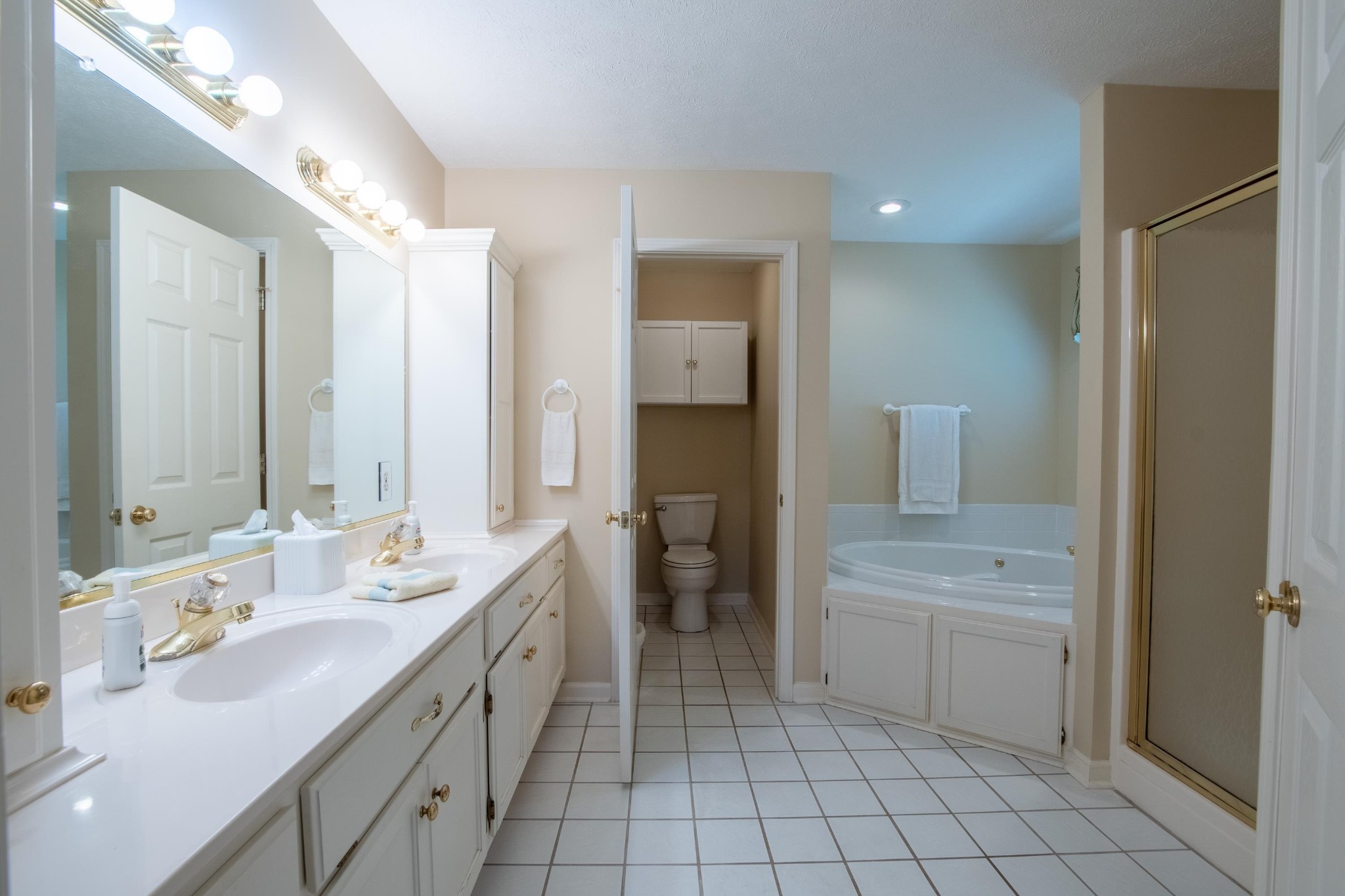 100 Vantage Pointe Counce, TN 38326 - Photo 13 of 33 a spacious bathroom with a double vanity sink a mirror and a bathtub