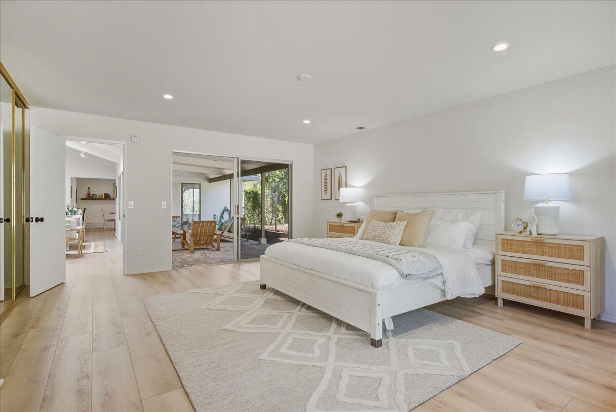 674 Chalk Hill Road Solvang, CA 93463 - Photo 11 of 52 a spacious bedroom with a bed and a large window