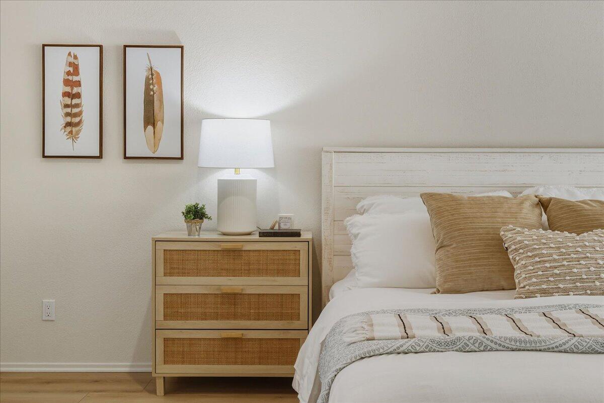 674 Chalk Hill Road Solvang, CA 93463 - Photo 13 of 52 a bedroom with a bed and painting on the wall