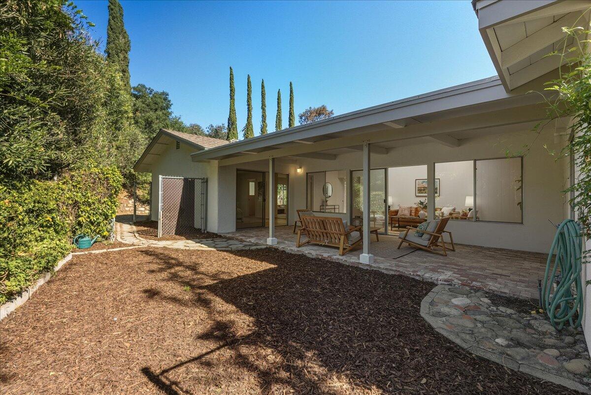 674 Chalk Hill Road Solvang, CA 93463 - Photo 19 of 52 a view of a house with backyard and porch
