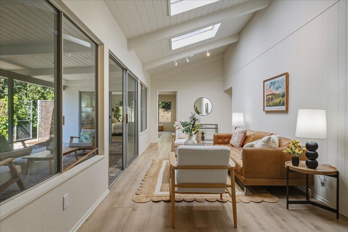 674 Chalk Hill Road Solvang, CA 93463 - Photo 20 of 52 a living room with furniture and a wooden floor
