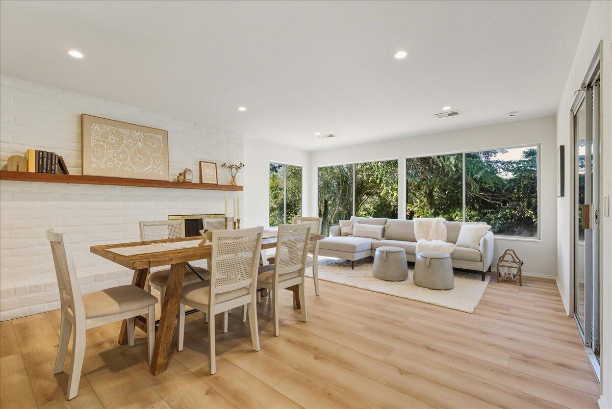 674 Chalk Hill Road Solvang, CA 93463 - Photo 21 of 52 a view of a dining room with furniture window and wooden floor