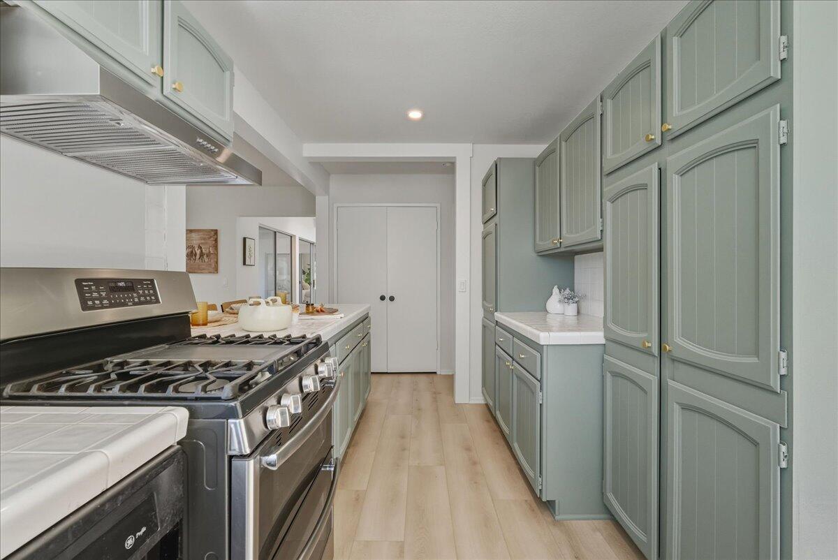674 Chalk Hill Road Solvang, CA 93463 - Photo 30 of 52 a kitchen with a stove and a sink