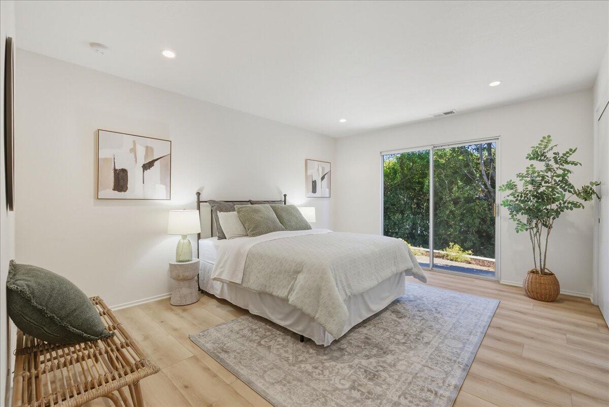 674 Chalk Hill Road Solvang, CA 93463 - Photo 34 of 52 a bedroom with a bed and a large window