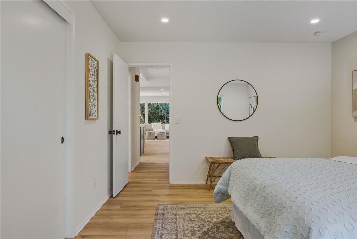 674 Chalk Hill Road Solvang, CA 93463 - Photo 35 of 52 a bedroom with bed and a mirror