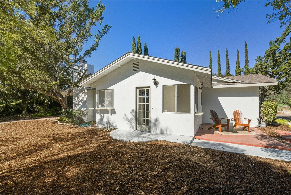 674 Chalk Hill Road Solvang, CA 93463 - Photo 42 of 52 a front view of a house with a yard