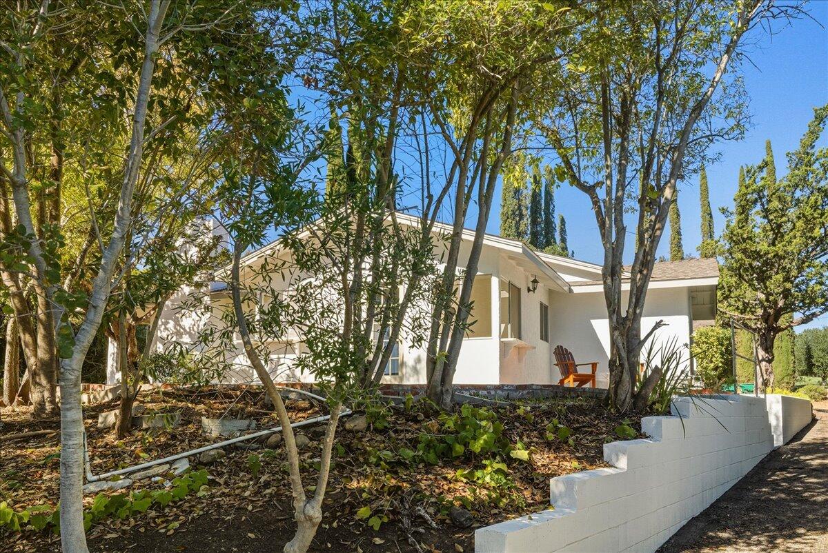 674 Chalk Hill Road Solvang, CA 93463 - Photo 43 of 52 a front view of a house with garden