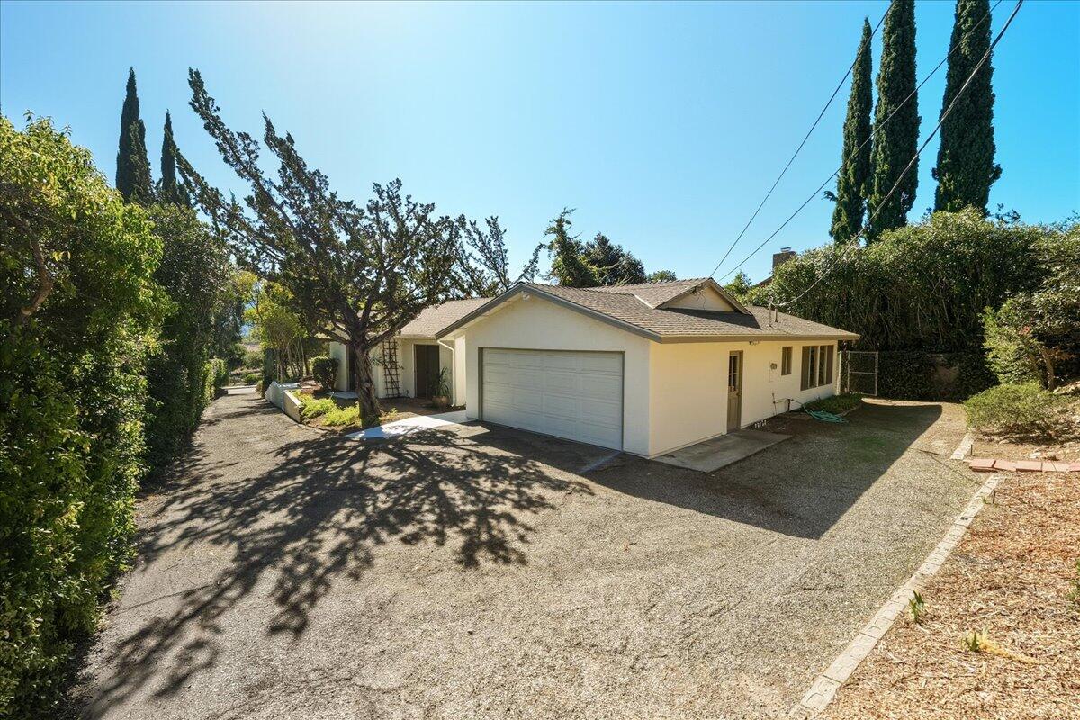 674 Chalk Hill Road Solvang, CA 93463 - Photo 48 of 52 a front view of a house with a yard