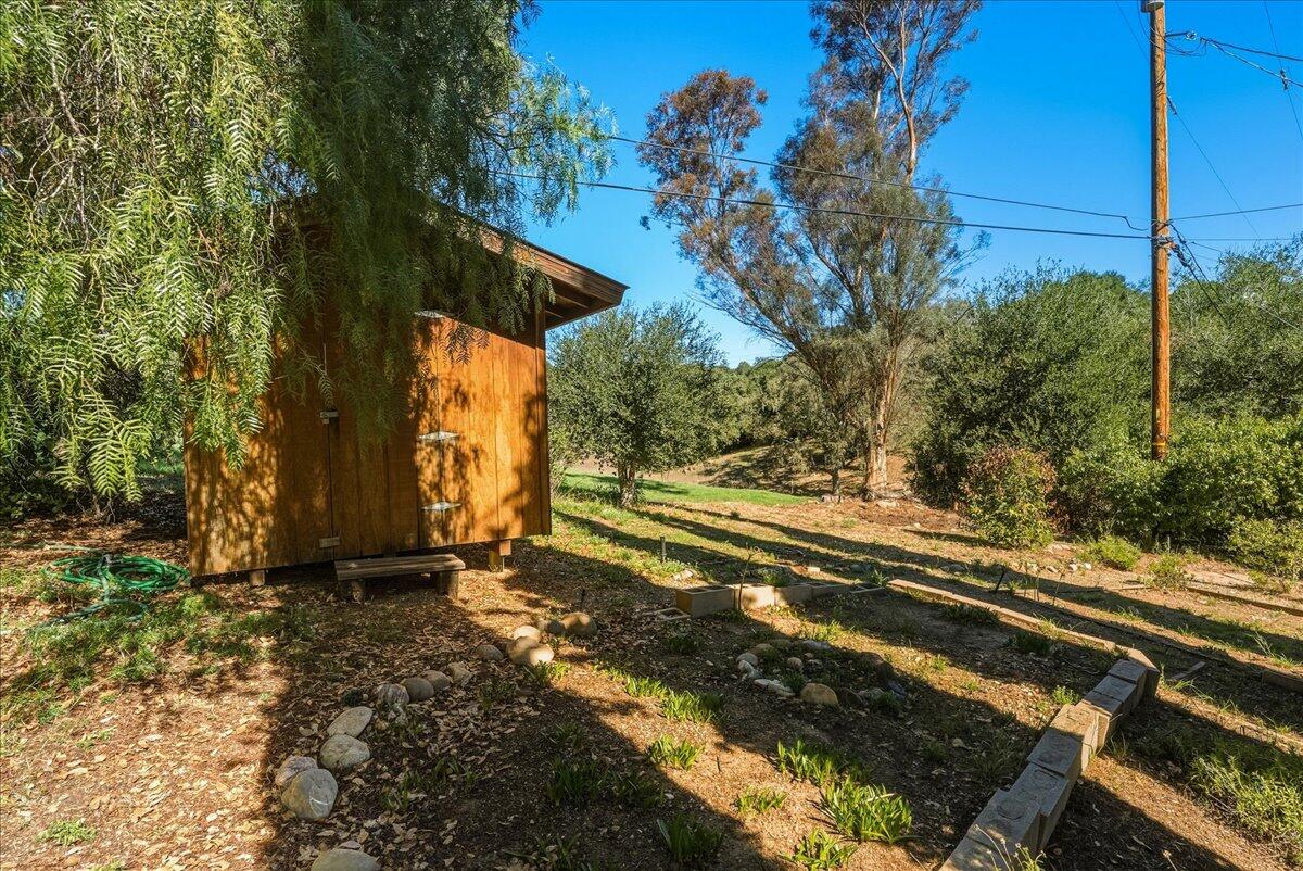 674 Chalk Hill Road Solvang, CA 93463 - Photo 49 of 52 a view of a yard with an tree