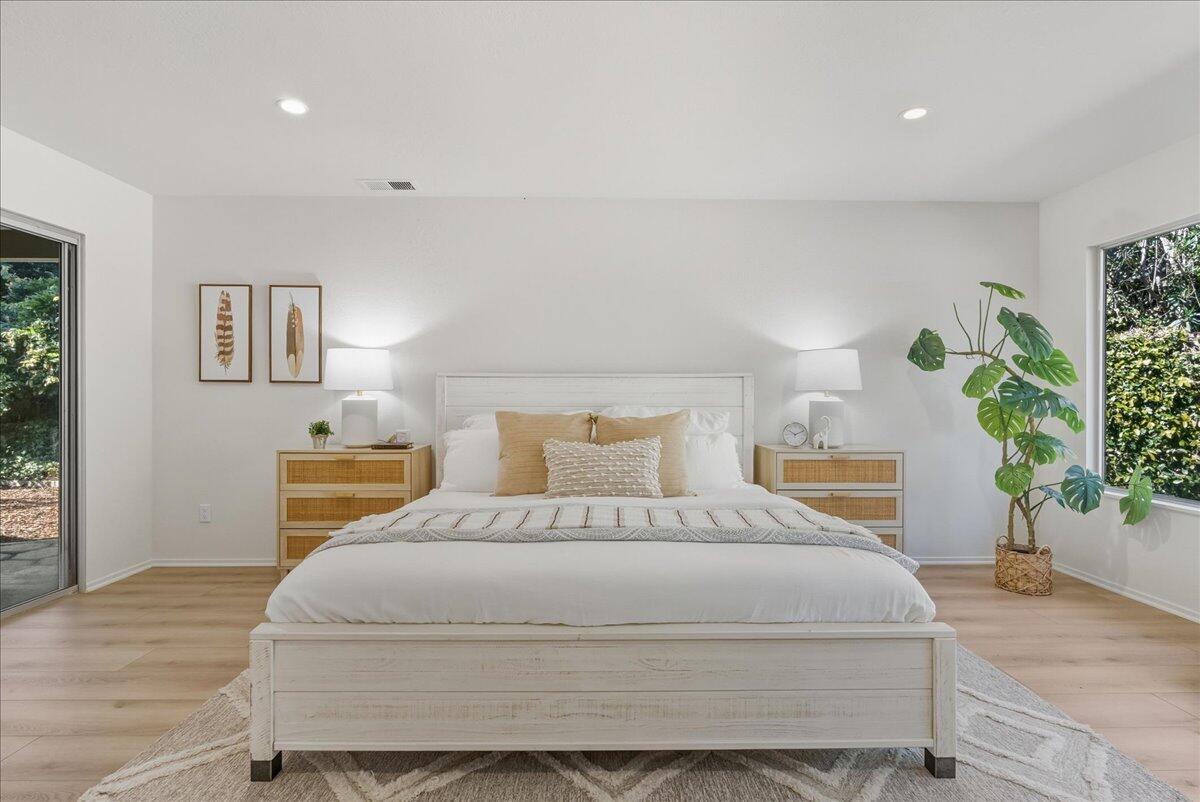 674 Chalk Hill Road Solvang, CA 93463 - Photo 10 of 52 a bedroom with a large bed and a potted plant