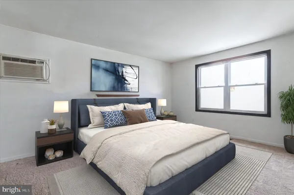 a bedroom with bed and a window
