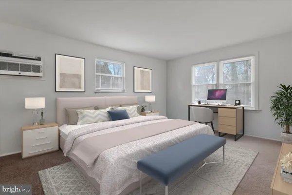 a bedroom with a bed and a table