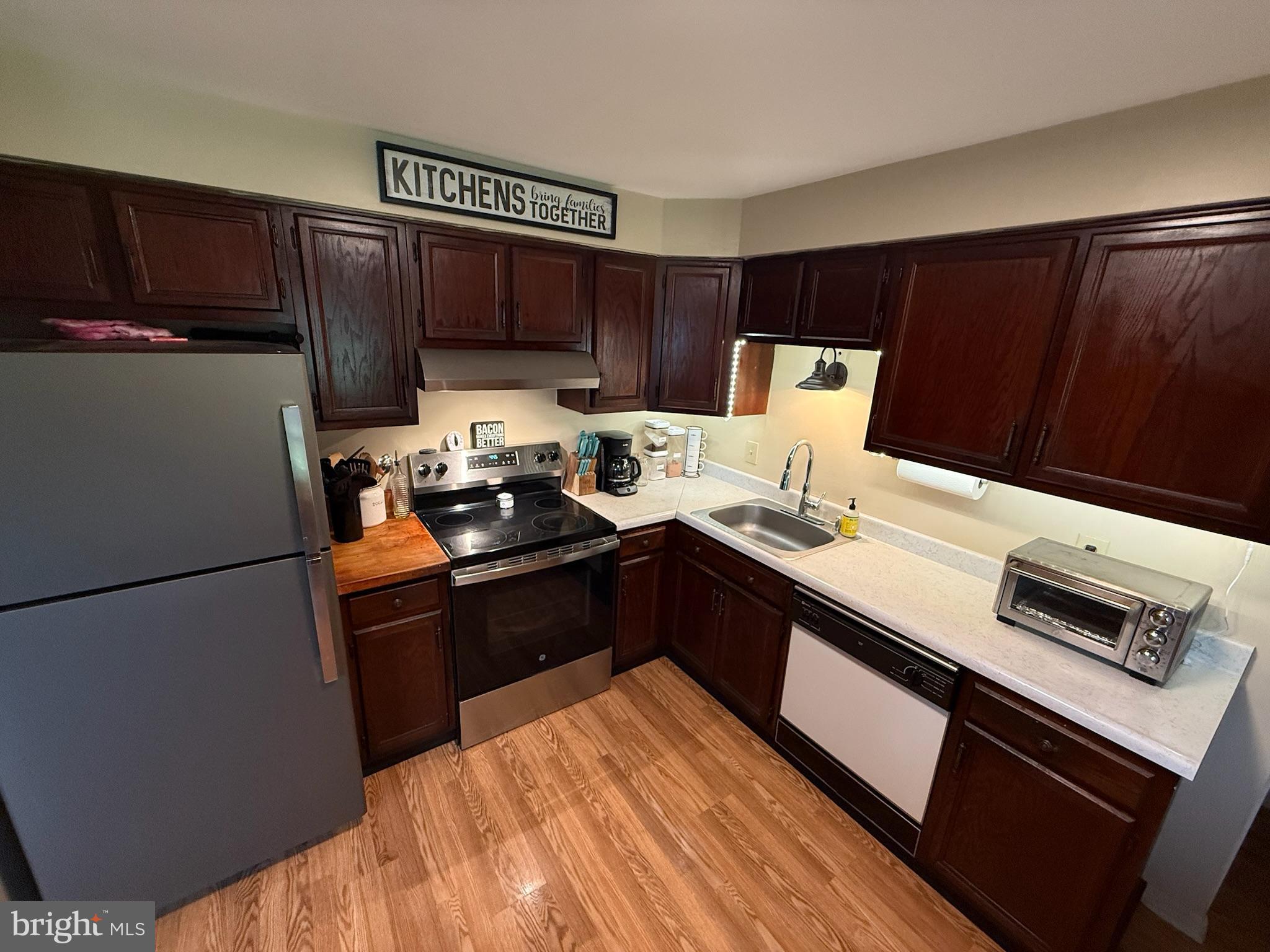 440 Scotland Road Quarryville, PA 17566 - Photo 11 of 35 a kitchen with a refrigerator and a stove top oven
