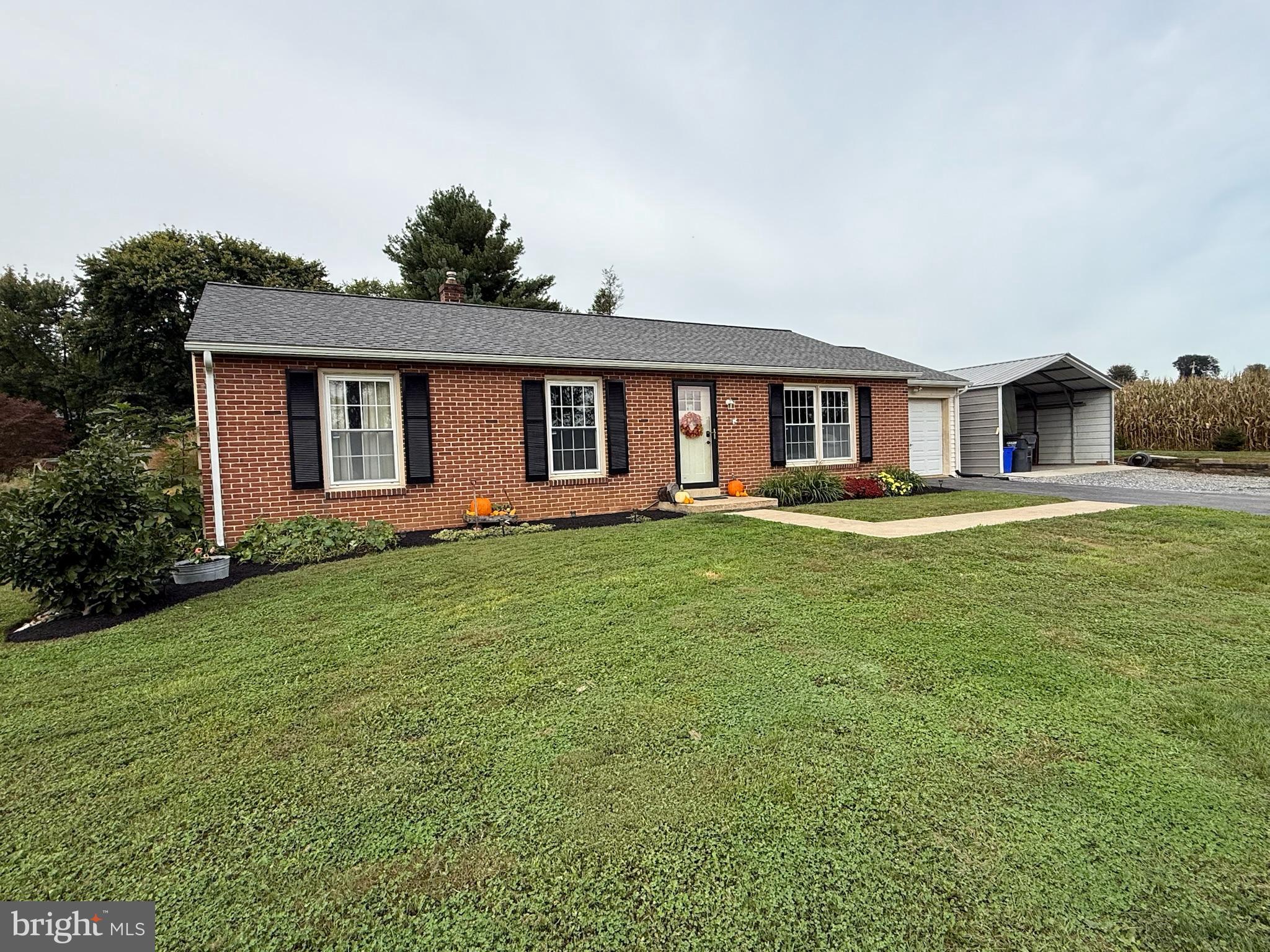 440 Scotland Road Quarryville, PA 17566 - Photo 3 of 35 a front view of house with yard and green space