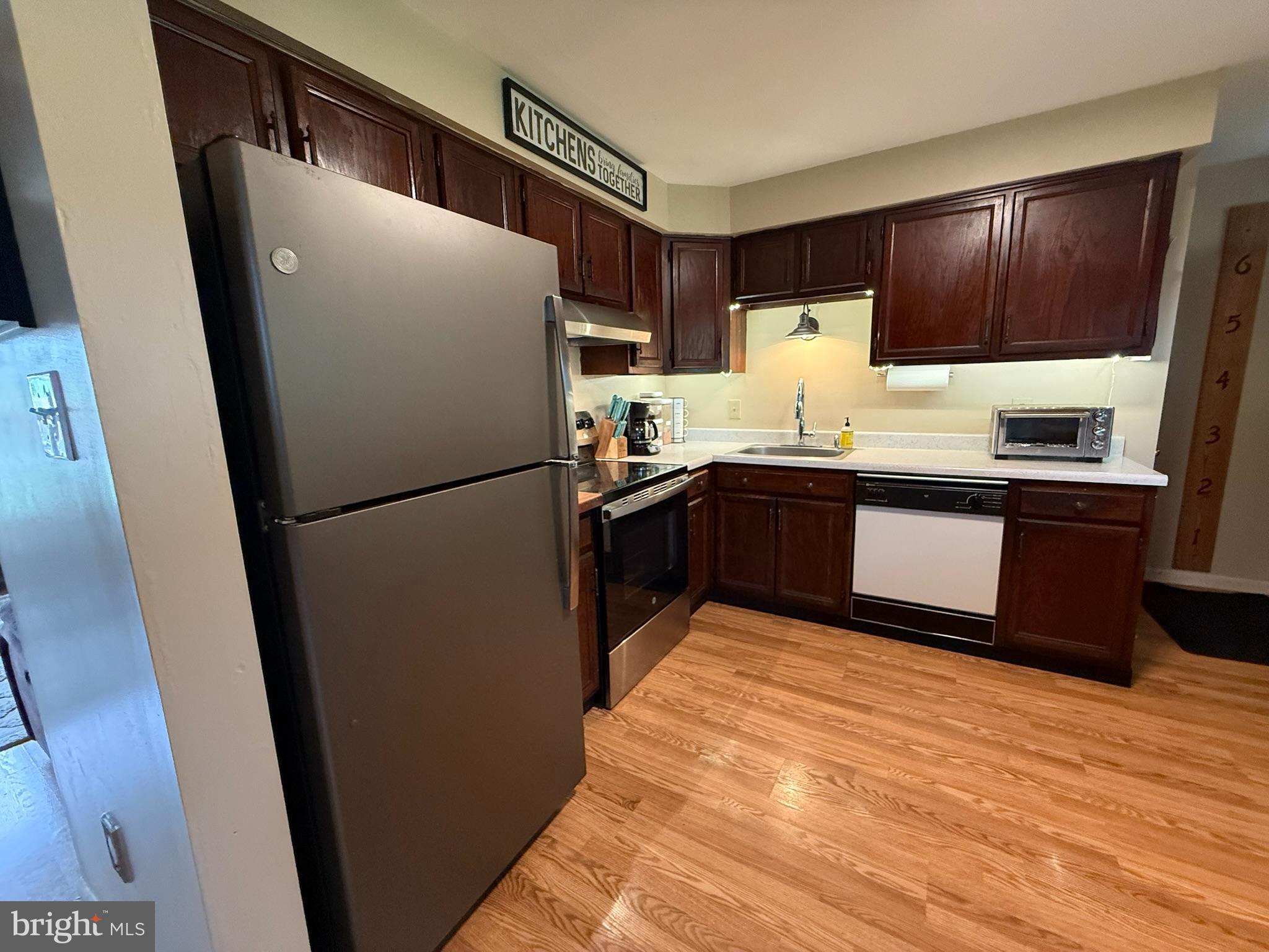 440 Scotland Road Quarryville, PA 17566 - Photo 9 of 35 a kitchen with granite countertop stainless steel appliances a refrigerator and a sink