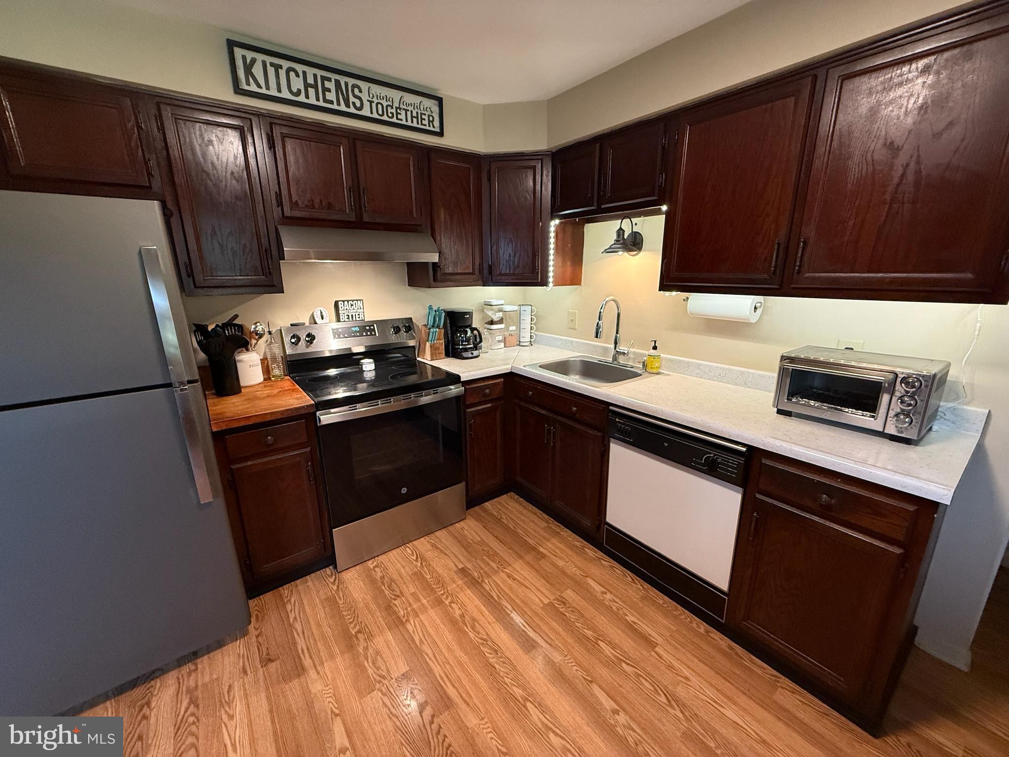 440 Scotland Road Quarryville, PA 17566 - Photo 10 of 35 a kitchen with stainless steel appliances granite countertop a refrigerator a sink dishwasher a stove top oven a refrigerator and cabinets