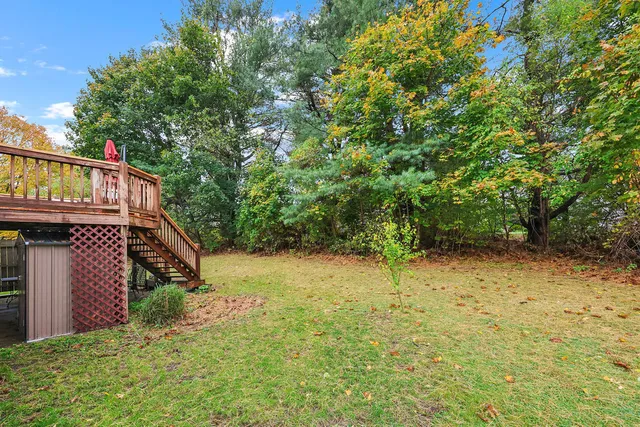a backyard of a house with lots of green space