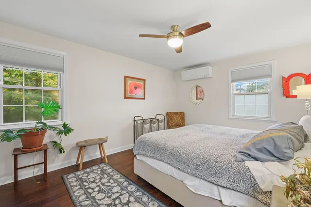 a bedroom with a bed and a chair