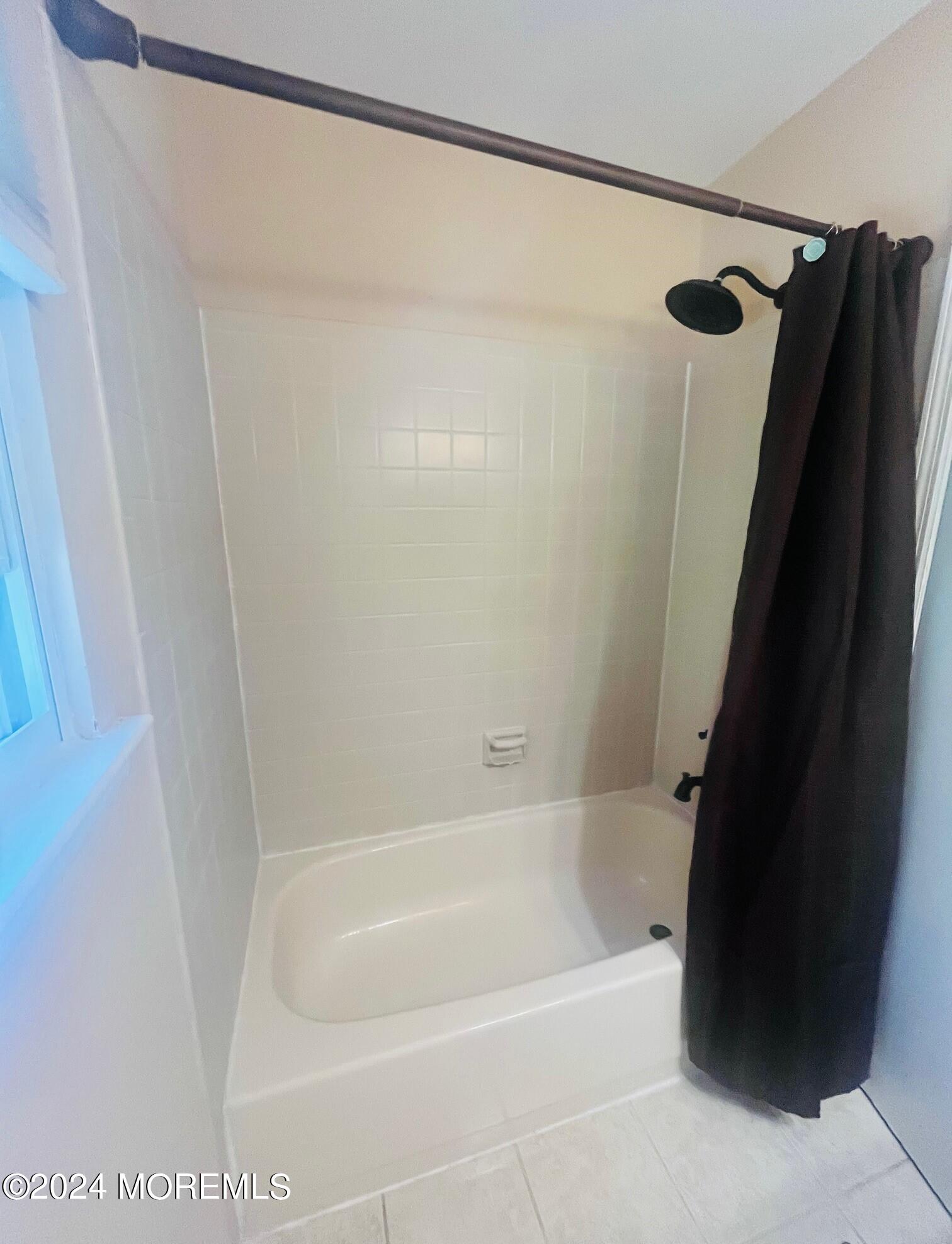 24 Flintlock Drive Howell, NJ 07731 - Photo 12 of 19 a bathroom with a shower and a bath tub
