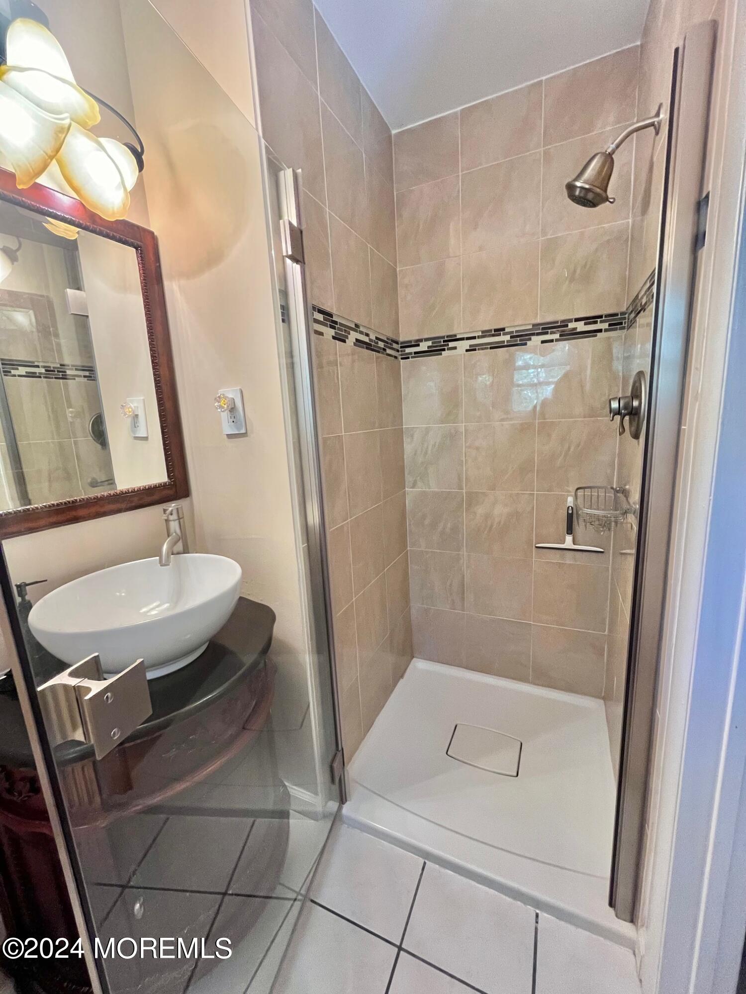 24 Flintlock Drive Howell, NJ 07731 - Photo 14 of 19 a bathroom with a sink and a mirror