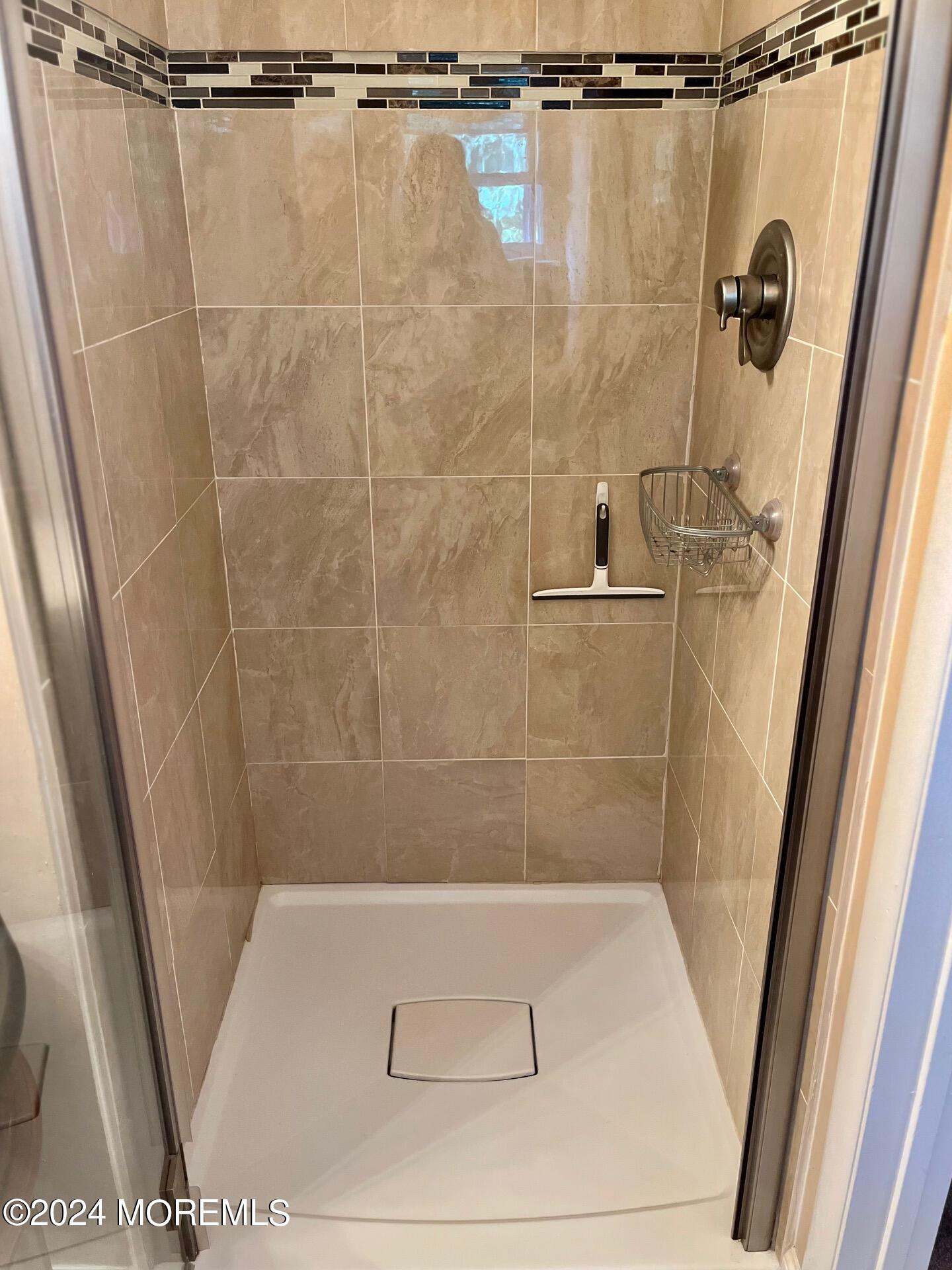 24 Flintlock Drive Howell, NJ 07731 - Photo 15 of 19 a bathroom with a shower and a sink