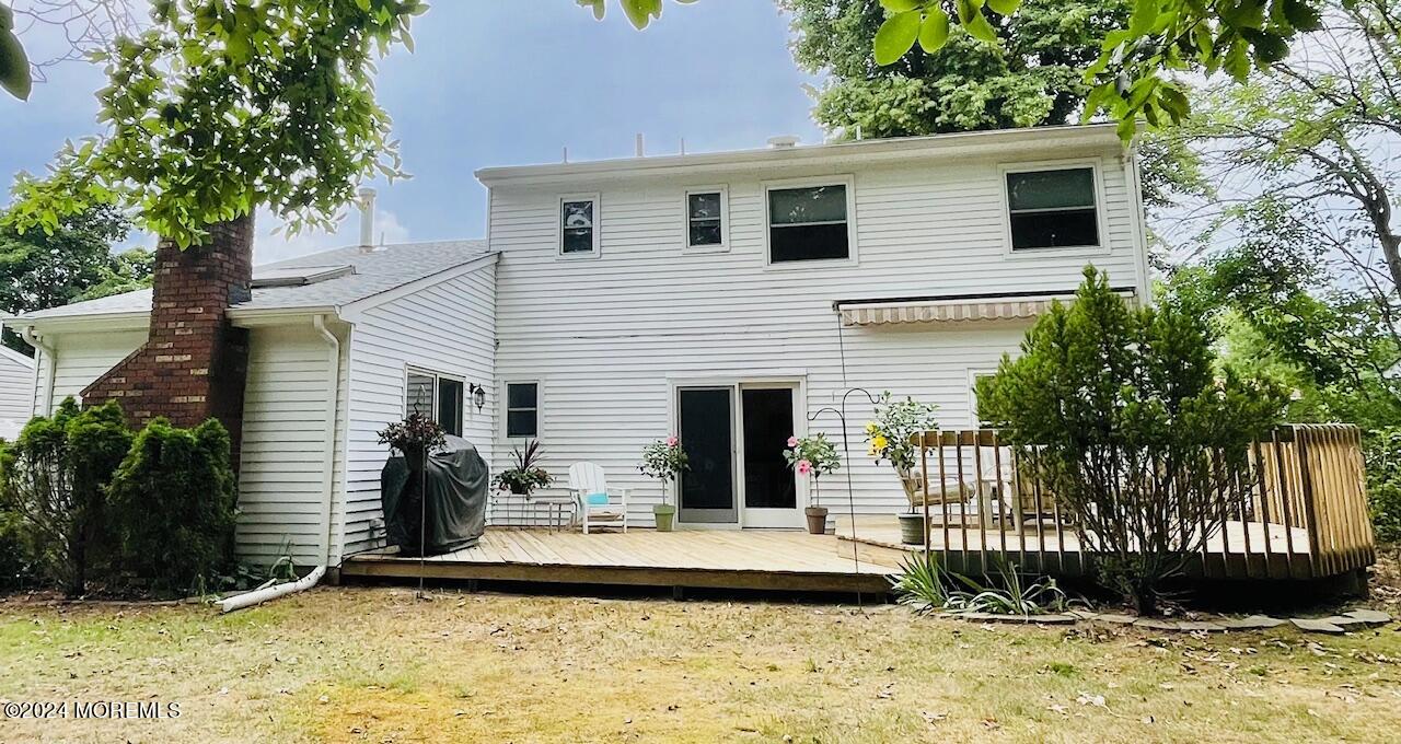24 Flintlock Drive Howell, NJ 07731 - Photo 18 of 19 a view of a house with backyard and sitting area