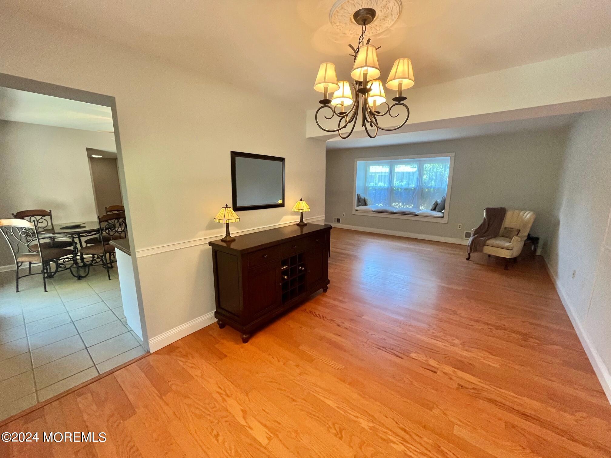 24 Flintlock Drive Howell, NJ 07731 - Photo 4 of 19 a living room with fireplace furniture and a flat screen tv