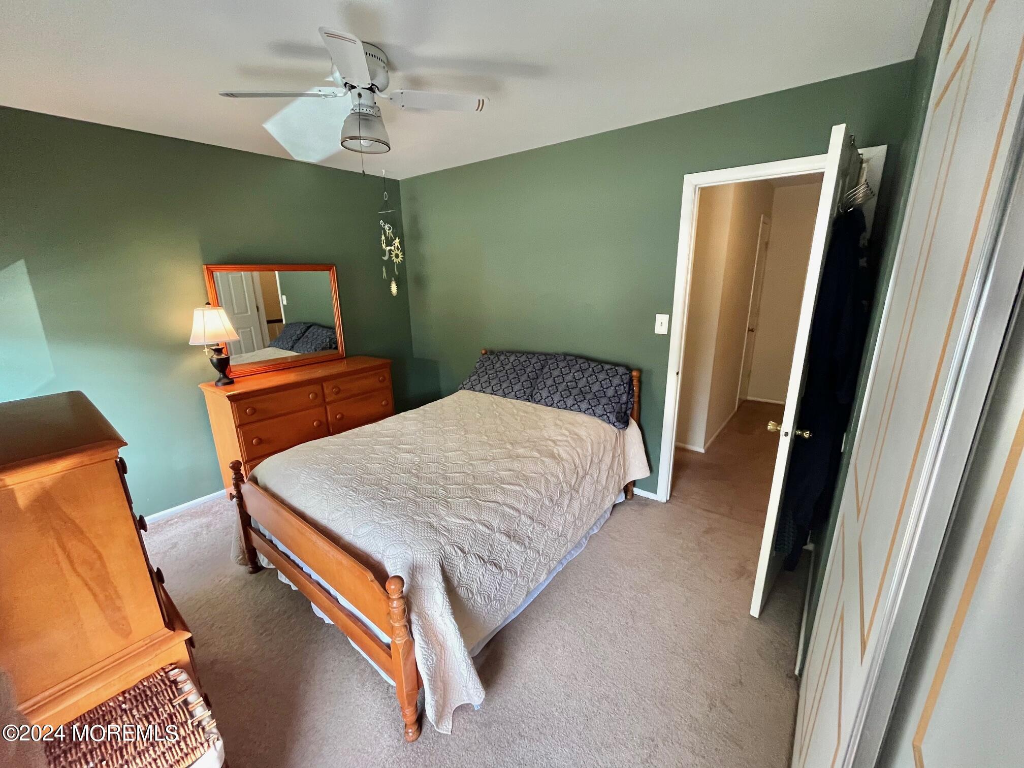 24 Flintlock Drive Howell, NJ 07731 - Photo 9 of 19 a bedroom with a bed and dresser with mirror