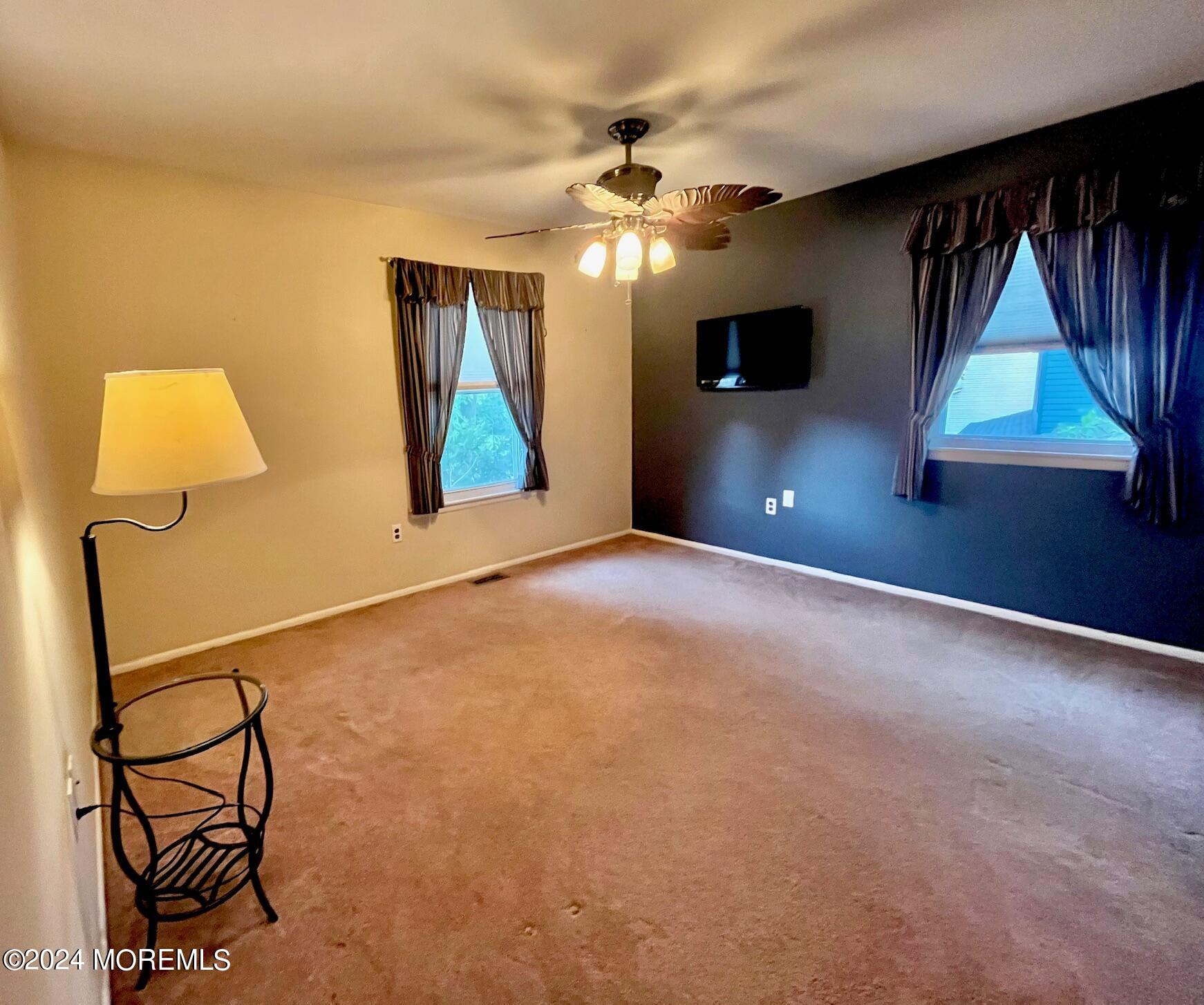 24 Flintlock Drive Howell, NJ 07731 - Photo 10 of 19 a view of a livingroom with furniture and a flat screen tv
