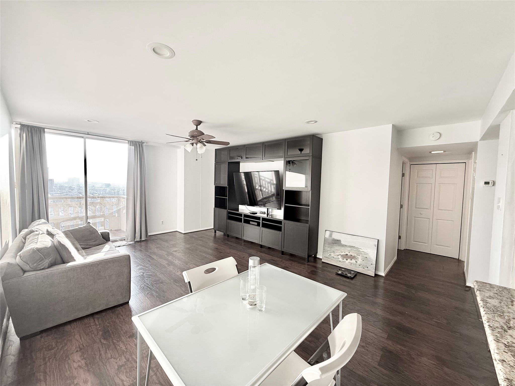 2016 Main Street, Unit 1914 Houston, TX 77002 - Photo 1 of 50 a living room with furniture and a large window