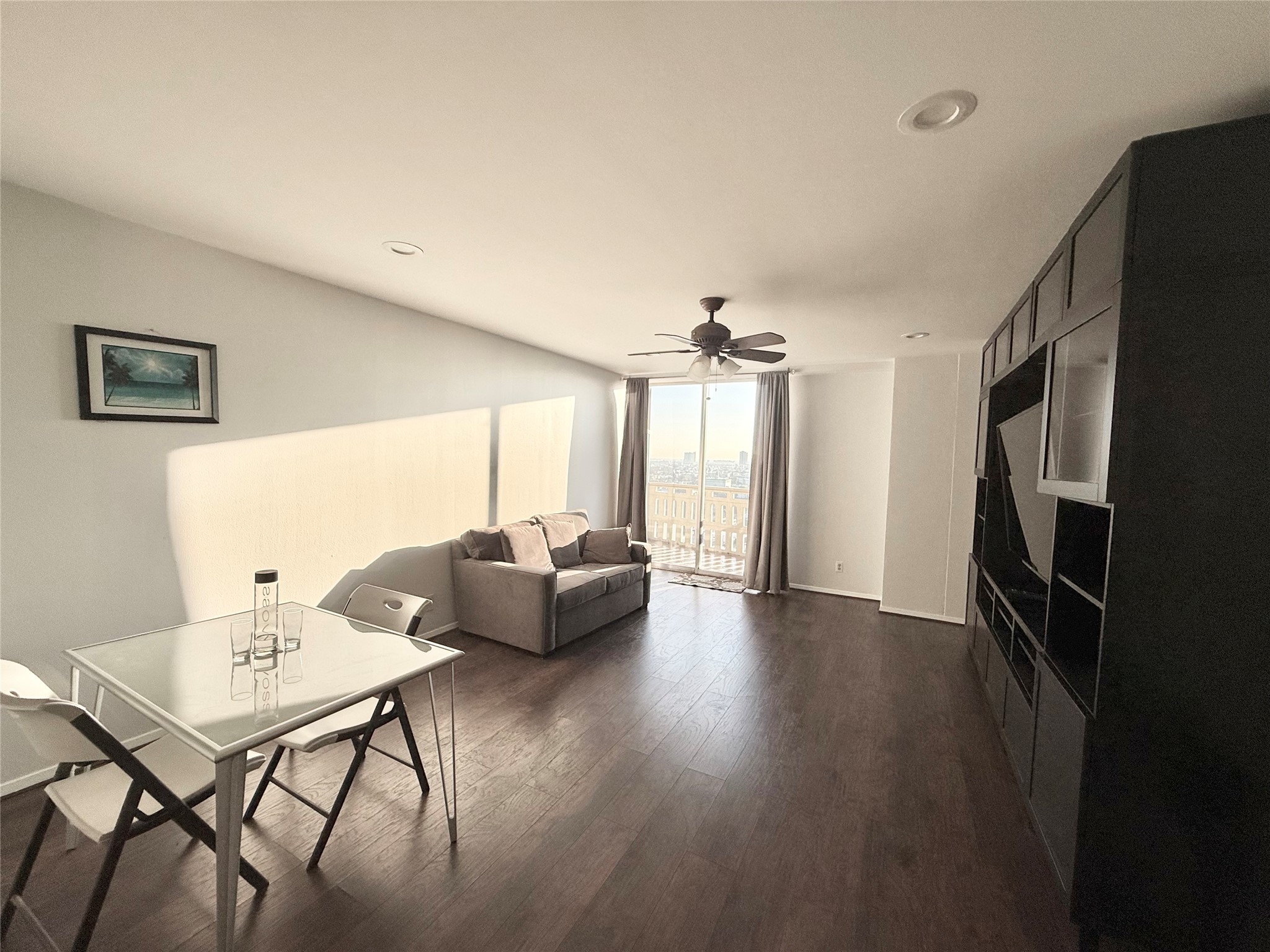 2016 Main Street, Unit 1914 Houston, TX 77002 - Photo 3 of 50 a living room with furniture and a flat screen tv