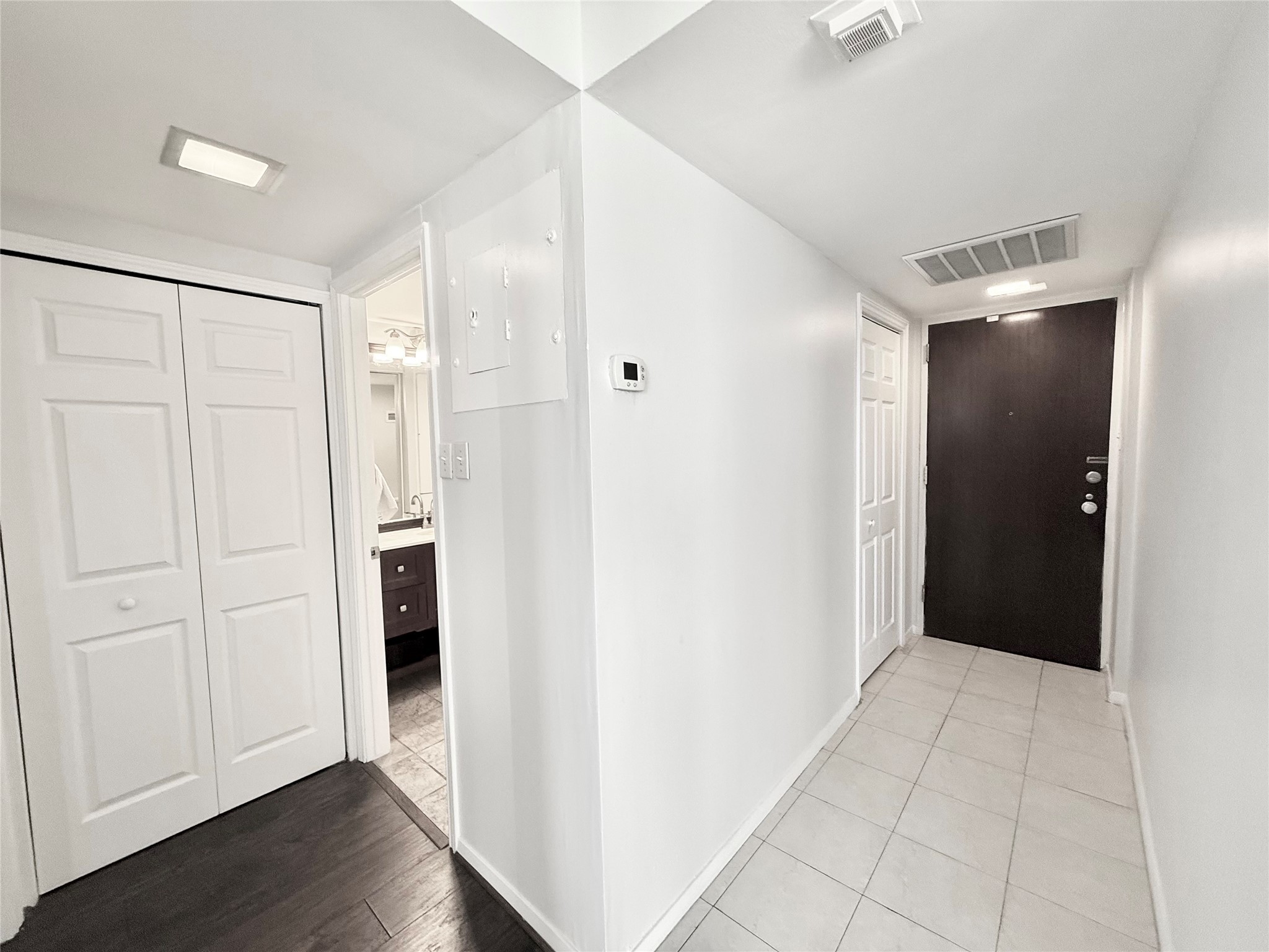 2016 Main Street, Unit 1914 Houston, TX 77002 - Photo 9 of 50 a view of a hallway with wooden floor